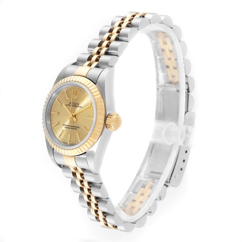 The image shows a side profile of the Rolex Oyster Perpetual 67193 Women
s Steel and Gold (two tone) Champagne Dial 67193 Women
s Steel and Gold (two tone) Champagne Dial watch, showcasing its two-tone bracelet, crown, and face.