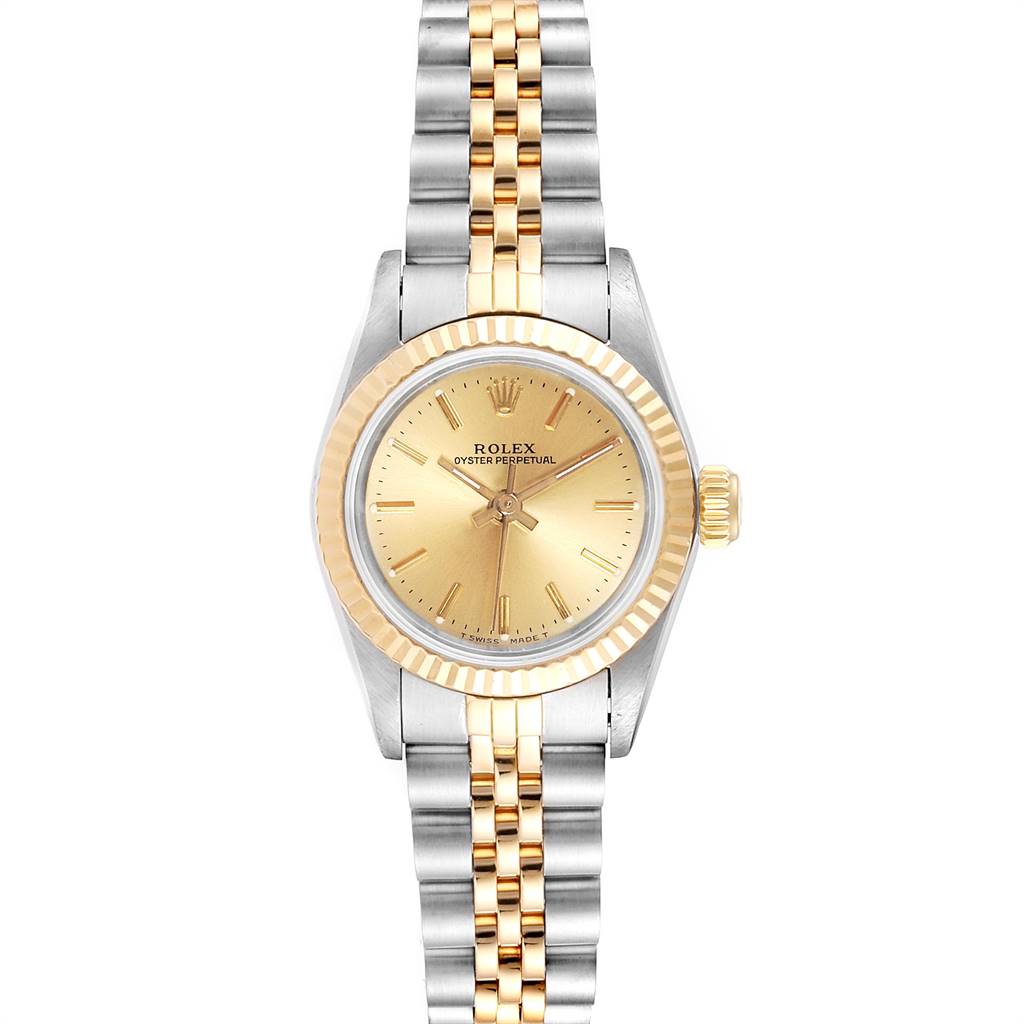 The image shows a front view of a Rolex Oyster Perpetual 67193 Women
s Steel and Gold (two tone) Champagne Dial 67193 Women
s Steel and Gold (two tone) Champagne Dial watch with a gold dial, fluted bezel, and two-tone bracelet.