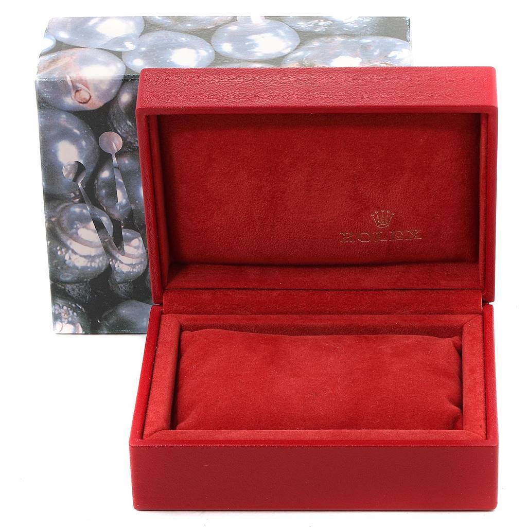 The image shows an open red watch box for the Oyster Perpetual model by Rolex, alongside its outer packaging.