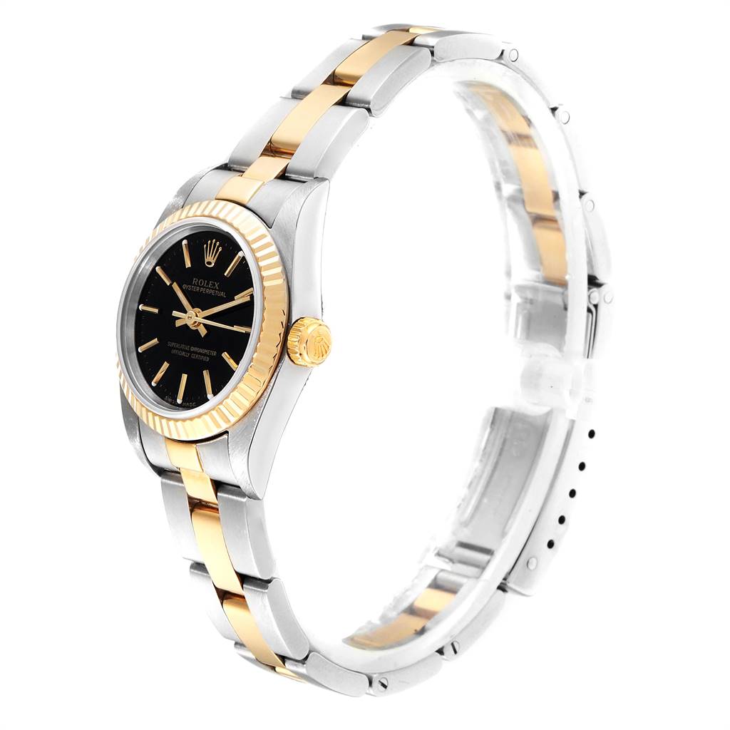 The Rolex Oyster Perpetual 76193 Women
s Steel and Gold (two tone) Black Dial 76193 Women
s Steel and Gold (two tone) Black Dial watch is shown at a 45-degree side angle, highlighting its two-tone bracelet and black dial.