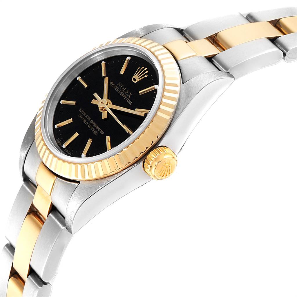 This image shows a side angle of a Rolex Oyster Perpetual 76193 Women
s Steel and Gold (two tone) Black Dial 76193 Women
s Steel and Gold (two tone) Black Dial watch, highlighting its black dial, gold fluted bezel, and bracelet.