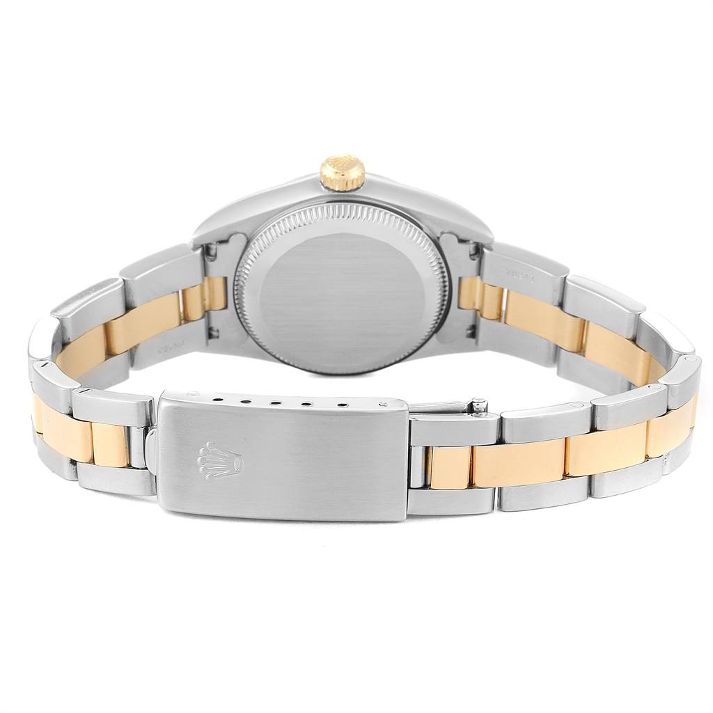 The image shows the back of a Rolex Oyster Perpetual 76193 Women
s Steel and Gold (two tone) Black Dial 76193 Women
s Steel and Gold (two tone) Black Dial watch, highlighting the case, crown, and two-tone bracelet clasp.