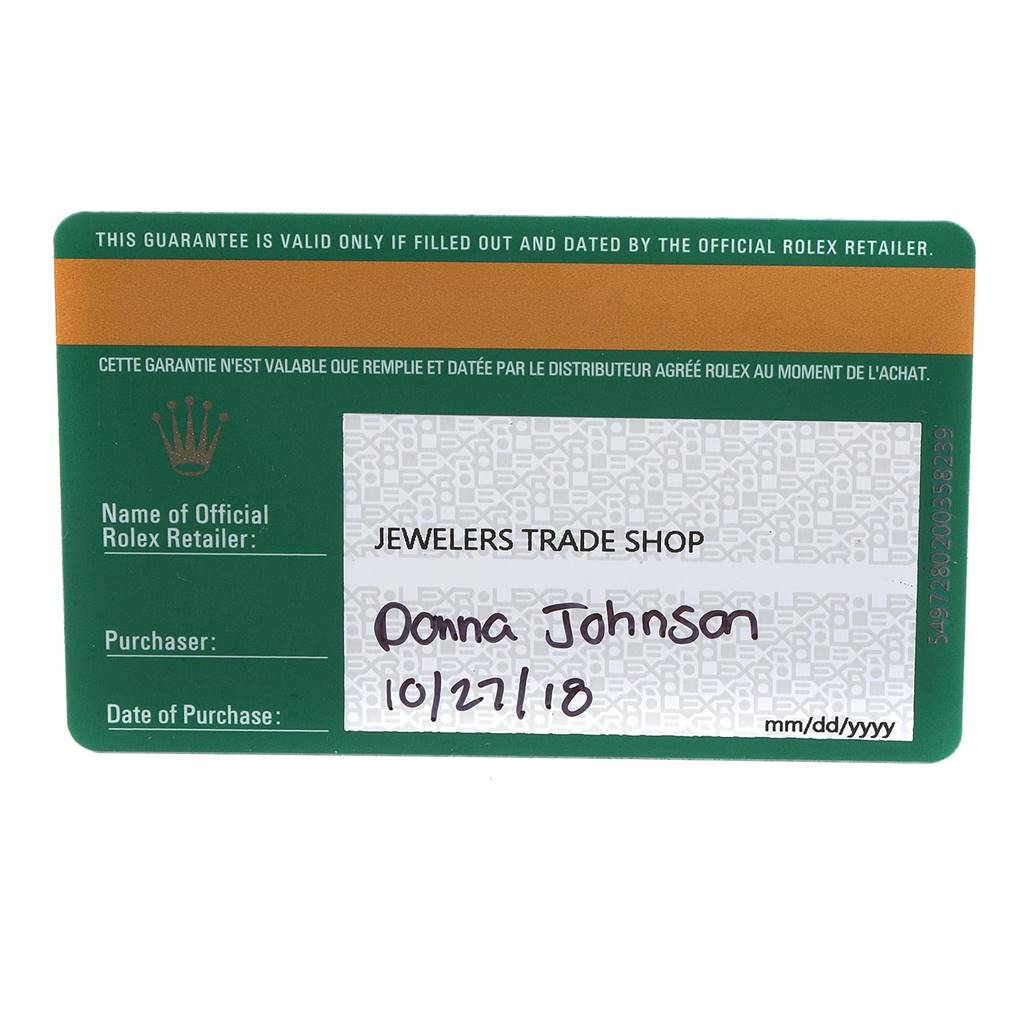This image shows a green Rolex warranty card for the Oyster Perpetual model, filled out by an official retailer.