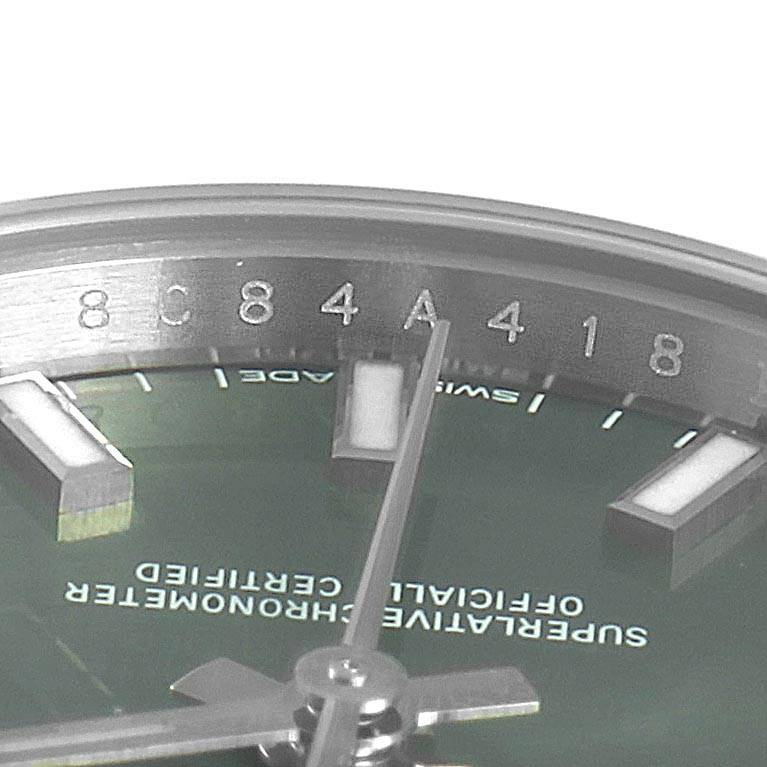 The image shows a close-up of the dial and partial bezel of a Rolex Oyster Perpetual 176200 Women's Stainless Steel Green Dial 176200 Women's Stainless Steel Green Dial watch, focusing on the hour markers and hands.