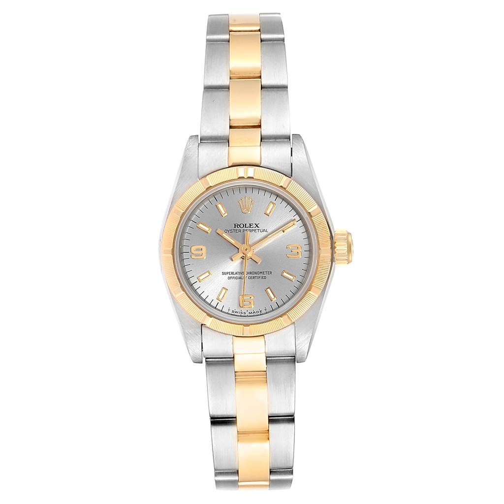The image shows a front view of a Rolex Oyster Perpetual 67233 Women's Steel and Gold (two tone) Grey Dial 67233 Women's Steel and Gold (two tone) Grey Dial watch with a two-tone metal bracelet and a silver dial.