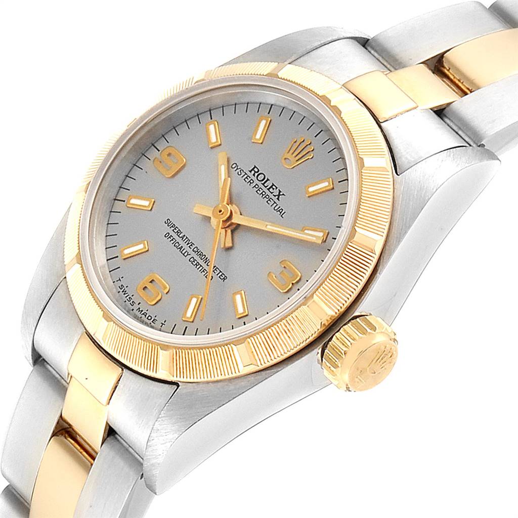 This image shows a Rolex Oyster Perpetual 67233 Women's Steel and Gold (two tone) Grey Dial 67233 Women's Steel and Gold (two tone) Grey Dial watch from a slightly angled view, highlighting the dial, bezel, crown, and bracelet.