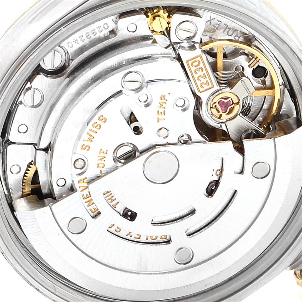 This is a close-up, internal view of the Rolex Oyster Perpetual 76243 Women
s Steel and Gold (two tone) Black Dial 76243 Women
s Steel and Gold (two tone) Black Dial watch movement.