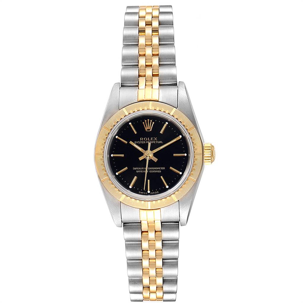 The image shows a front view of a Rolex Oyster Perpetual 76243 Women
s Steel and Gold (two tone) Black Dial 76243 Women
s Steel and Gold (two tone) Black Dial watch, highlighting its black dial, two-tone bracelet, and gold fluted bezel.
