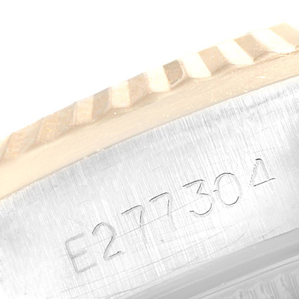This image shows a close-up of the serial number and fluted bezel of a Rolex Oyster Perpetual 67193 Women
s Steel and Gold (two tone) Champagne Dial 67193 Women
s Steel and Gold (two tone) Champagne Dial watch.