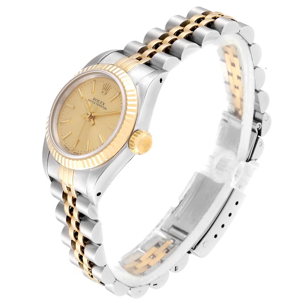 The image shows a side view of the Rolex Oyster Perpetual 67193 Women
s Steel and Gold (two tone) Champagne Dial 67193 Women
s Steel and Gold (two tone) Champagne Dial watch, including the dial, bezel, crown, and two-tone bracelet.