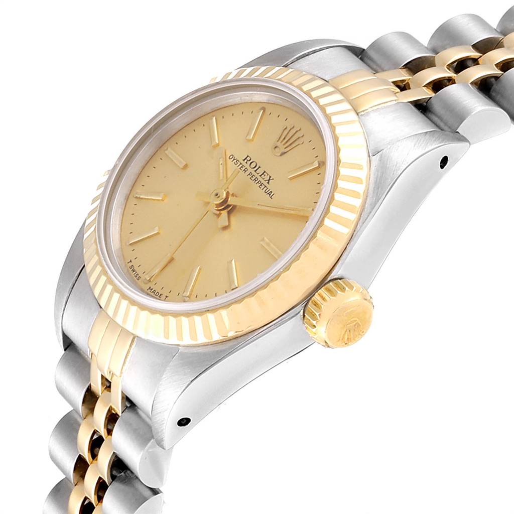 The Rolex Oyster Perpetual 67193 Women
s Steel and Gold (two tone) Champagne Dial 67193 Women
s Steel and Gold (two tone) Champagne Dial watch is shown at an angle highlighting the dial, bezel, and part of the bracelet.