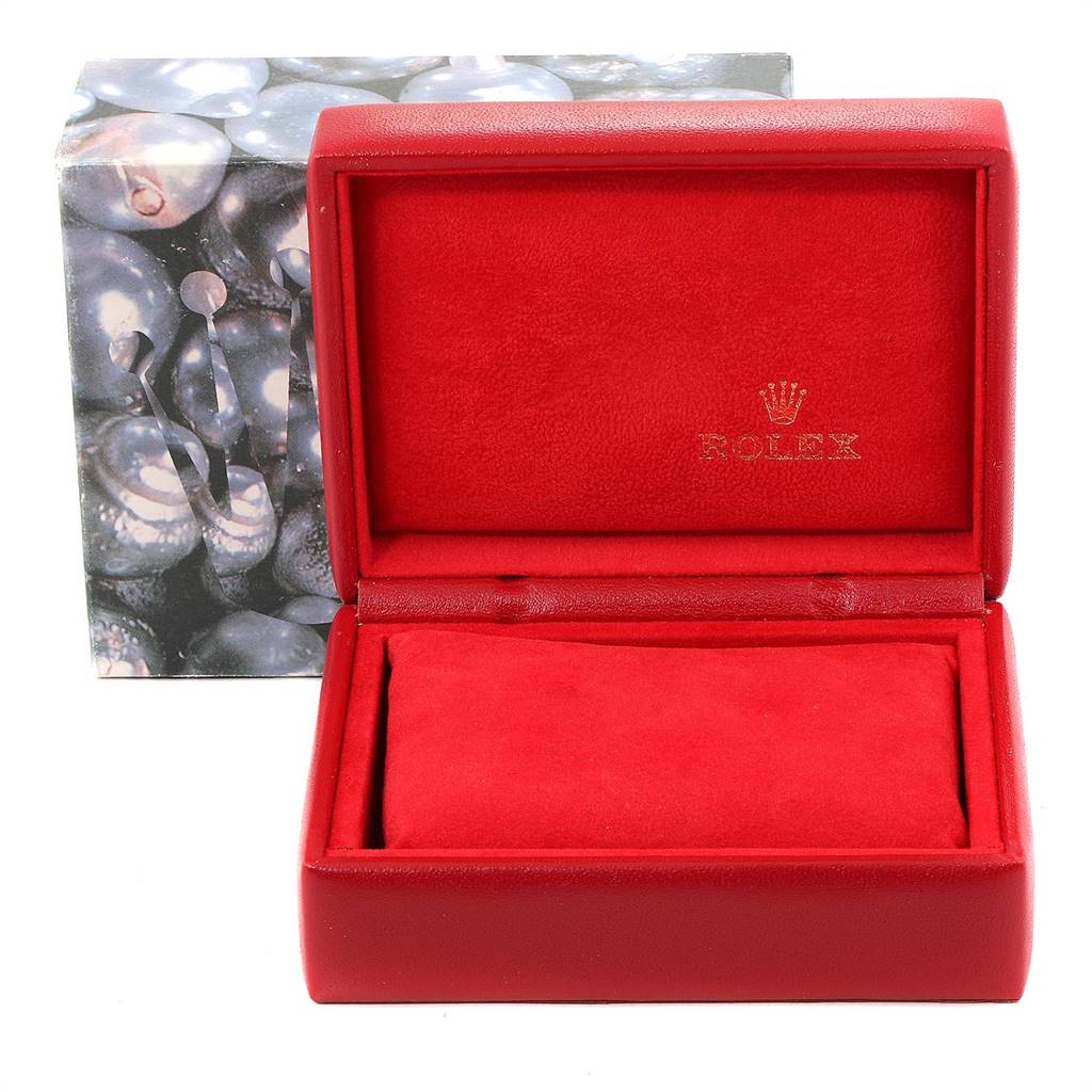The image shows an open red Rolex watch box for the Oyster Perpetual model.