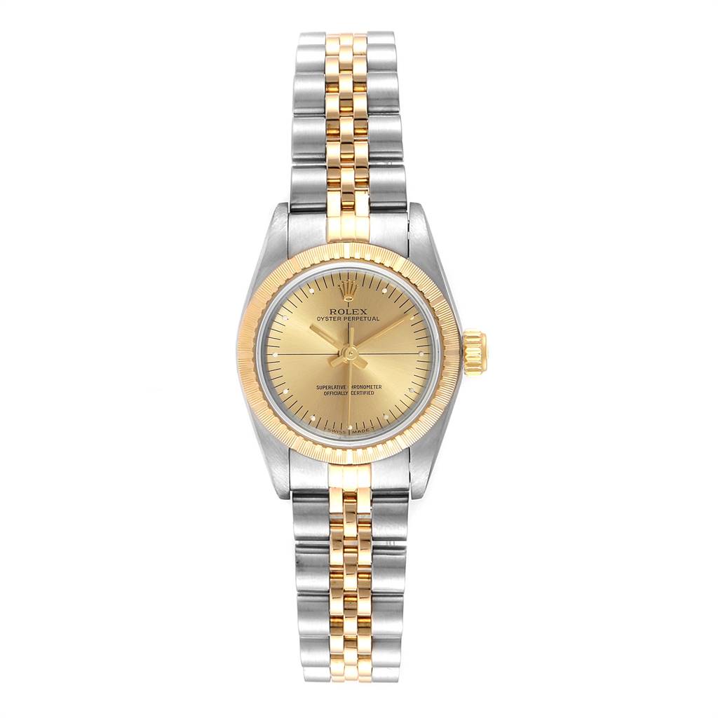 The image shows a front view of a Rolex Oyster Perpetual 67243 Women
s Steel and Gold (two tone) Champagne Dial 67243 Women
s Steel and Gold (two tone) Champagne Dial watch featuring a two-tone bracelet and a gold dial.