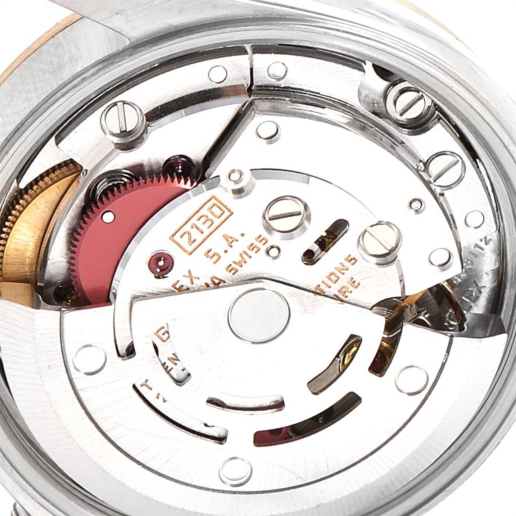 This image shows a close-up of the movement mechanism inside a Rolex Oyster Perpetual 67193 Women
s Steel and Gold (two tone) Champagne Dial 67193 Women
s Steel and Gold (two tone) Champagne Dial watch.