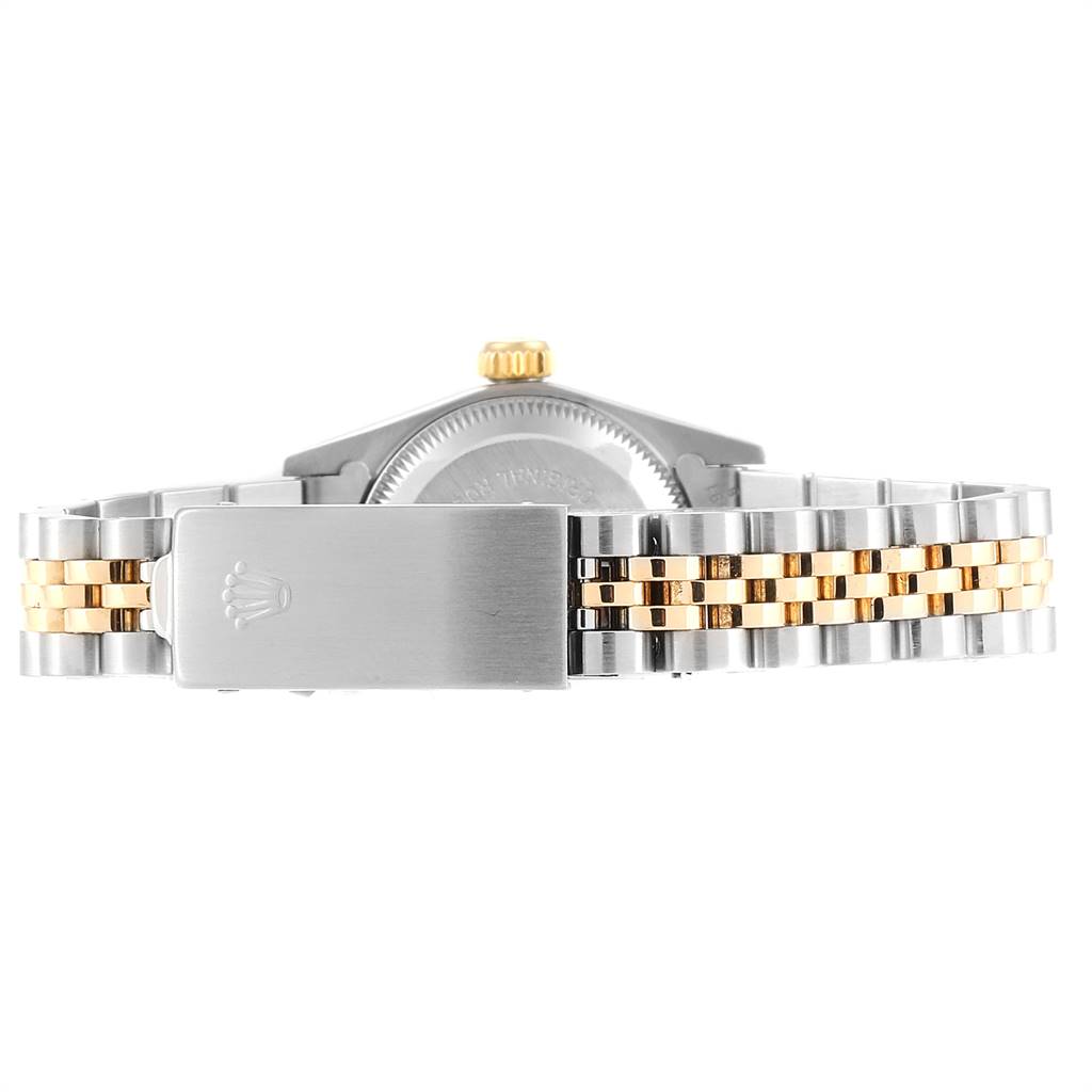 The image shows the back of the Rolex Oyster Perpetual 67193 Women
s Steel and Gold (two tone) Champagne Dial 67193 Women
s Steel and Gold (two tone) Champagne Dial watch focusing on the bracelet clasp and part of the case.