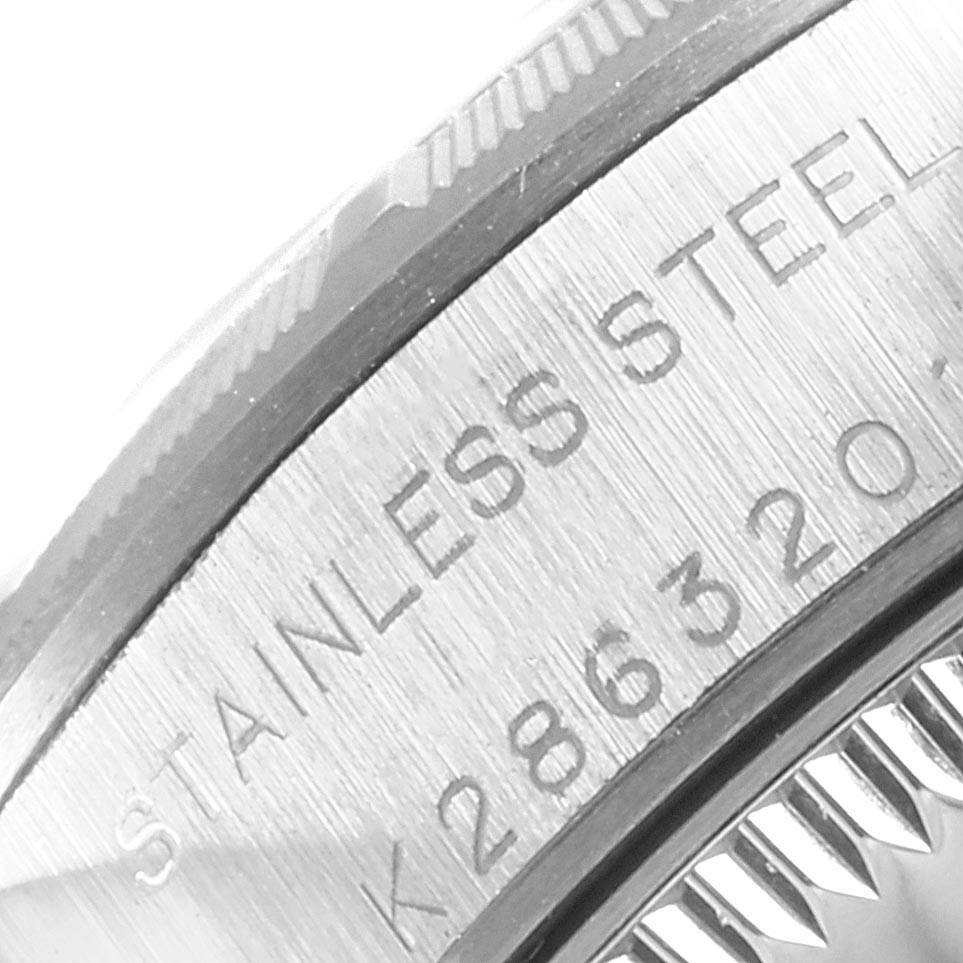 This image shows a close-up of the stainless steel case back with etched markings on a Rolex Oyster Perpetual 76030 Women
s Stainless Steel Pink Dial 76030 Women
s Stainless Steel Pink Dial watch.