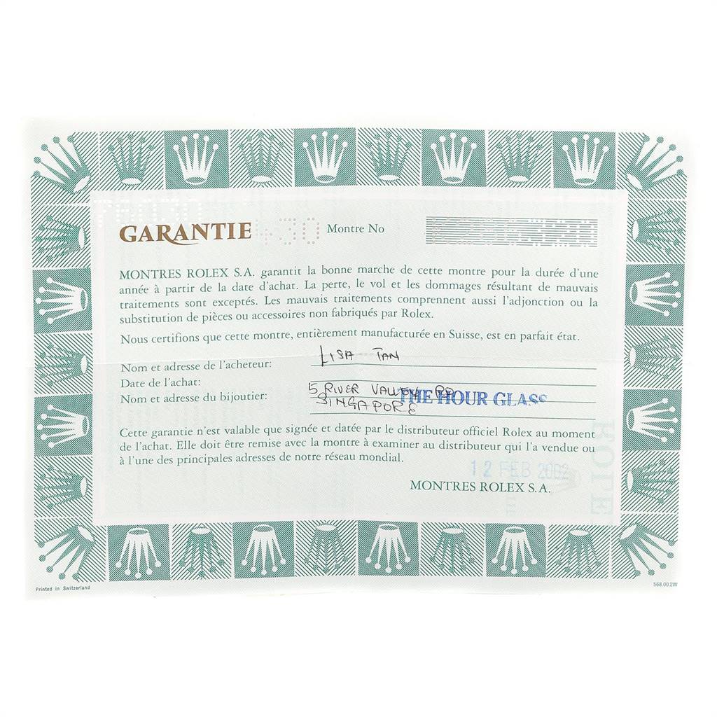 The image shows a warranty card for a Rolex Oyster Perpetual 76030 Women
s Stainless Steel Pink Dial 76030 Women
s Stainless Steel Pink Dial watch, featuring the brand
s trademark green border.