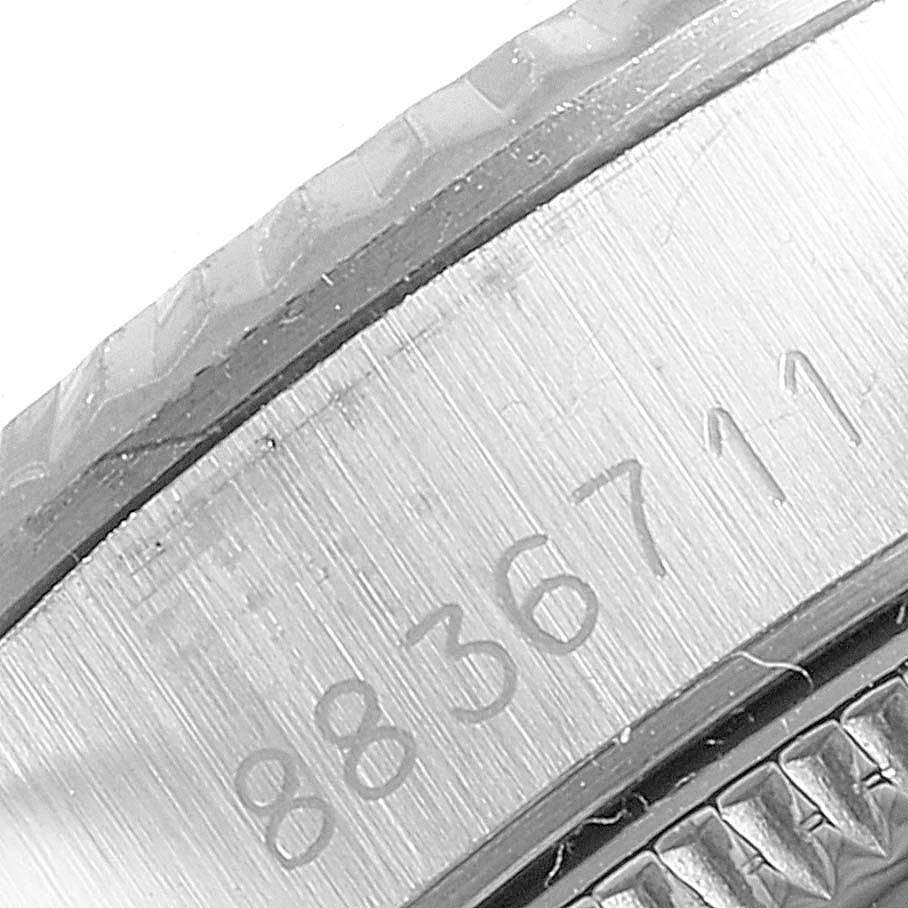 This image shows a close-up angle of the case edge and serial engraving of a Rolex Oyster Perpetual 67194 Women's Stainless Steel Silver Dial 67194 Women's Stainless Steel Silver Dial watch.