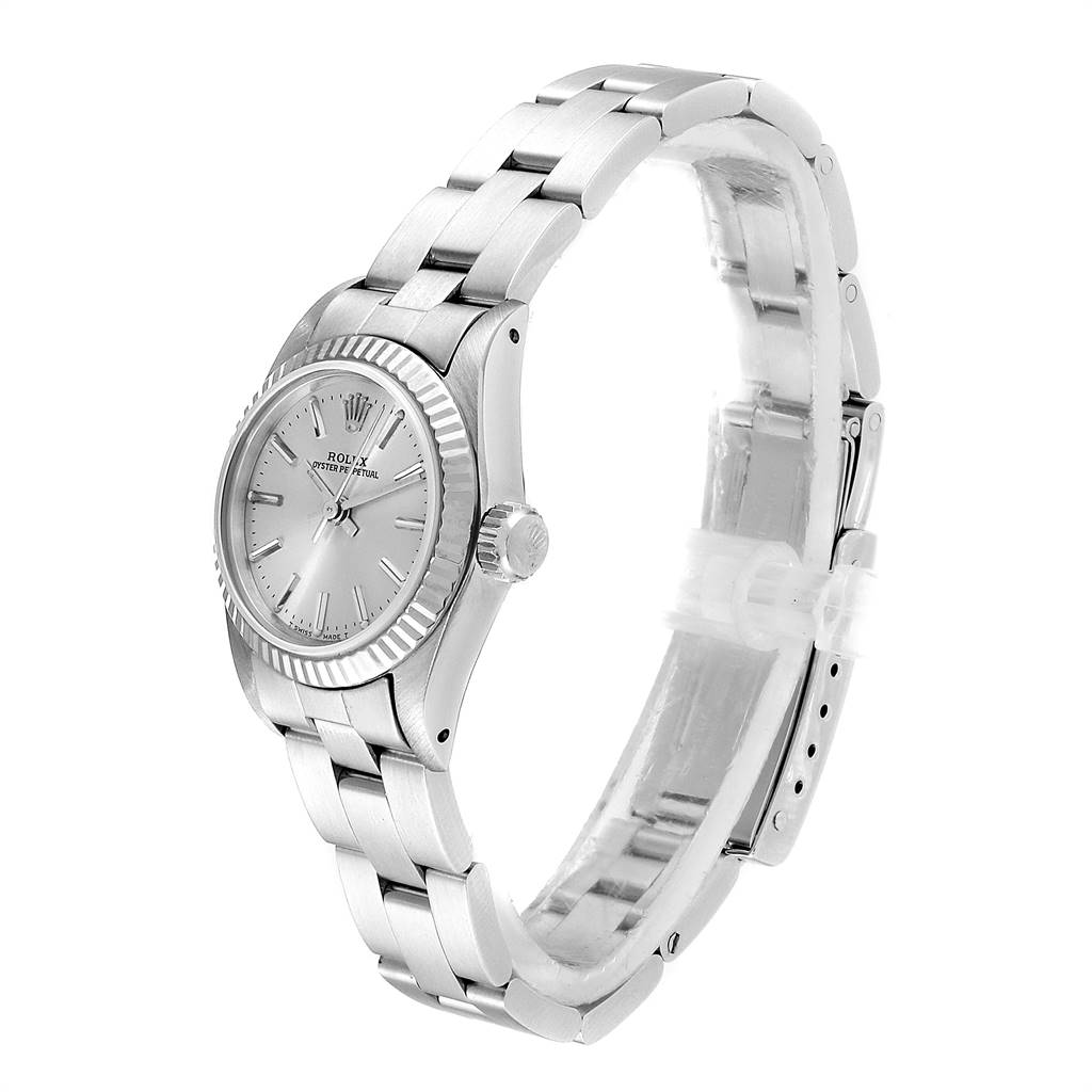 The Rolex Oyster Perpetual 67194 Women's Stainless Steel Silver Dial 67194 Women's Stainless Steel Silver Dial watch is shown at an angle highlighting the face, bezel, crown, and part of the bracelet.
