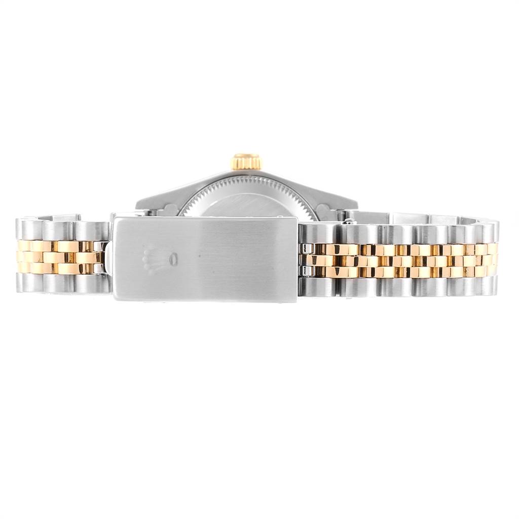 This image shows the clasp and the back of the bracelet for a Rolex Oyster Perpetual 76193 Women's Steel and Gold (two tone) Black Dial 76193 Women's Steel and Gold (two tone) Black Dial watch, displaying a two-tone metal design.