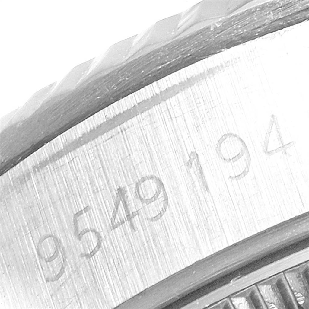 This close-up image shows a portion of the case with serial numbers etched on the Rolex Oyster Perpetual 67194 Women
s Stainless Steel White Dial 67194 Women
s Stainless Steel White Dial watch.