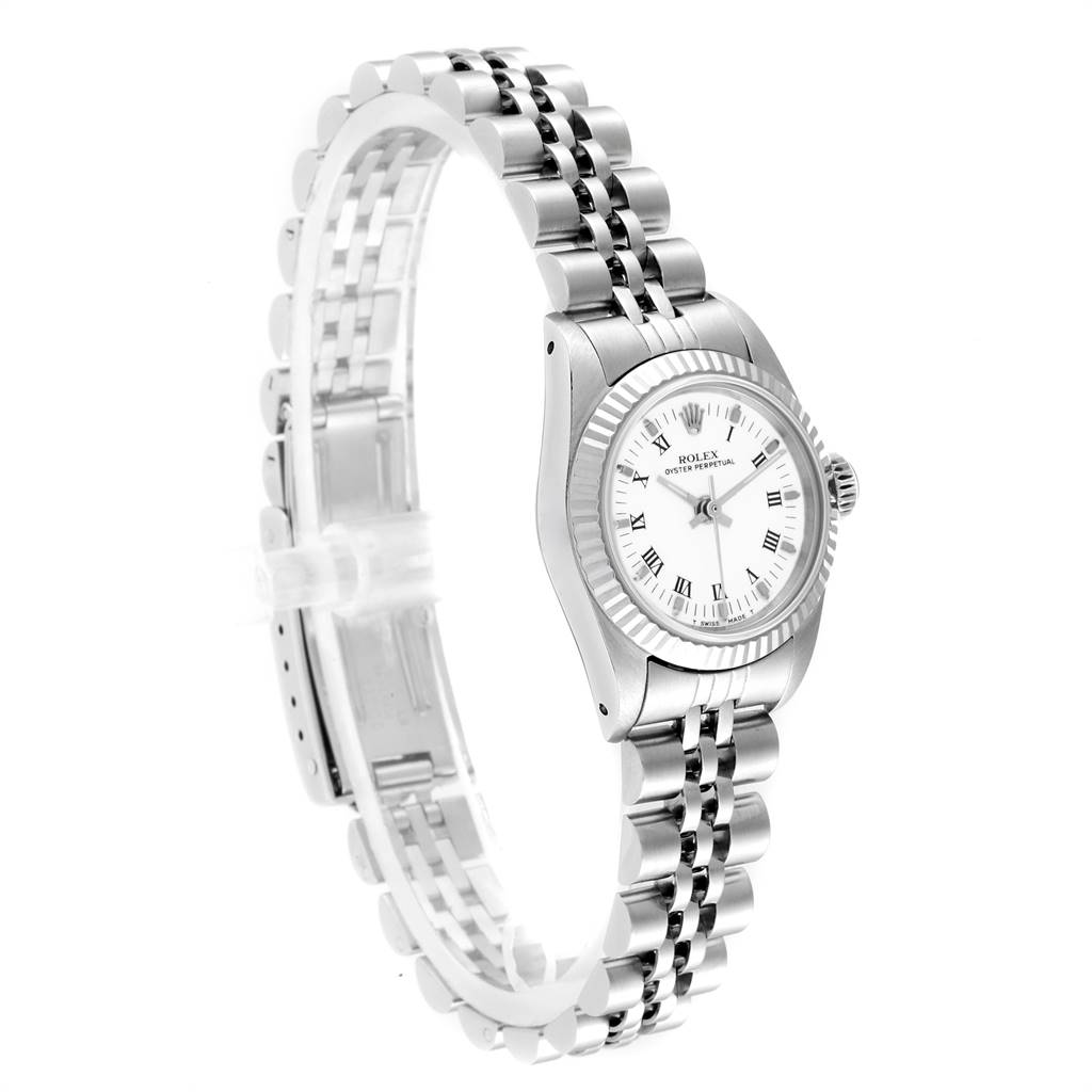 The image shows a Rolex Oyster Perpetual 67194 Women
s Stainless Steel White Dial 67194 Women
s Stainless Steel White Dial watch from a left side angle, highlighting the face, bezel, and bracelet.