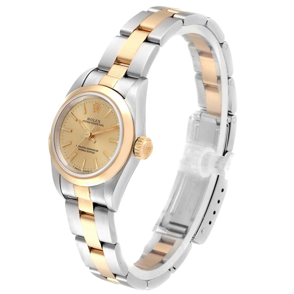 The Rolex Oyster Perpetual 67183 Women
s Steel and Gold (two tone) Champagne Dial 67183 Women
s Steel and Gold (two tone) Champagne Dial watch is shown at a slight angle, highlighting its face, bezel, crown, and two-tone bracelet.