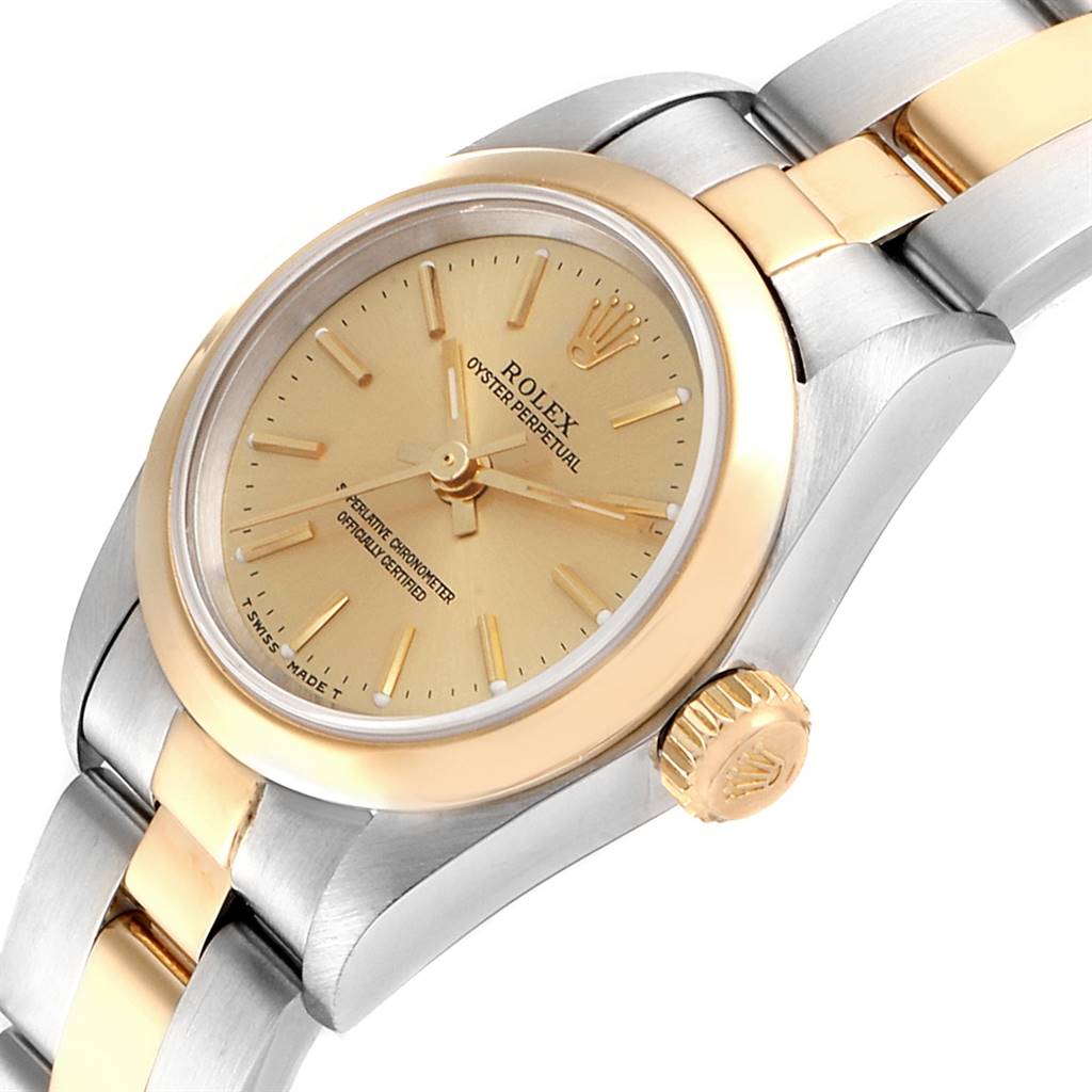 This image shows a close-up, angled view of the Rolex Oyster Perpetual 67183 Women
s Steel and Gold (two tone) Champagne Dial 67183 Women
s Steel and Gold (two tone) Champagne Dial, highlighting the gold and stainless steel case, bezel, dial, and part of the bracelet.