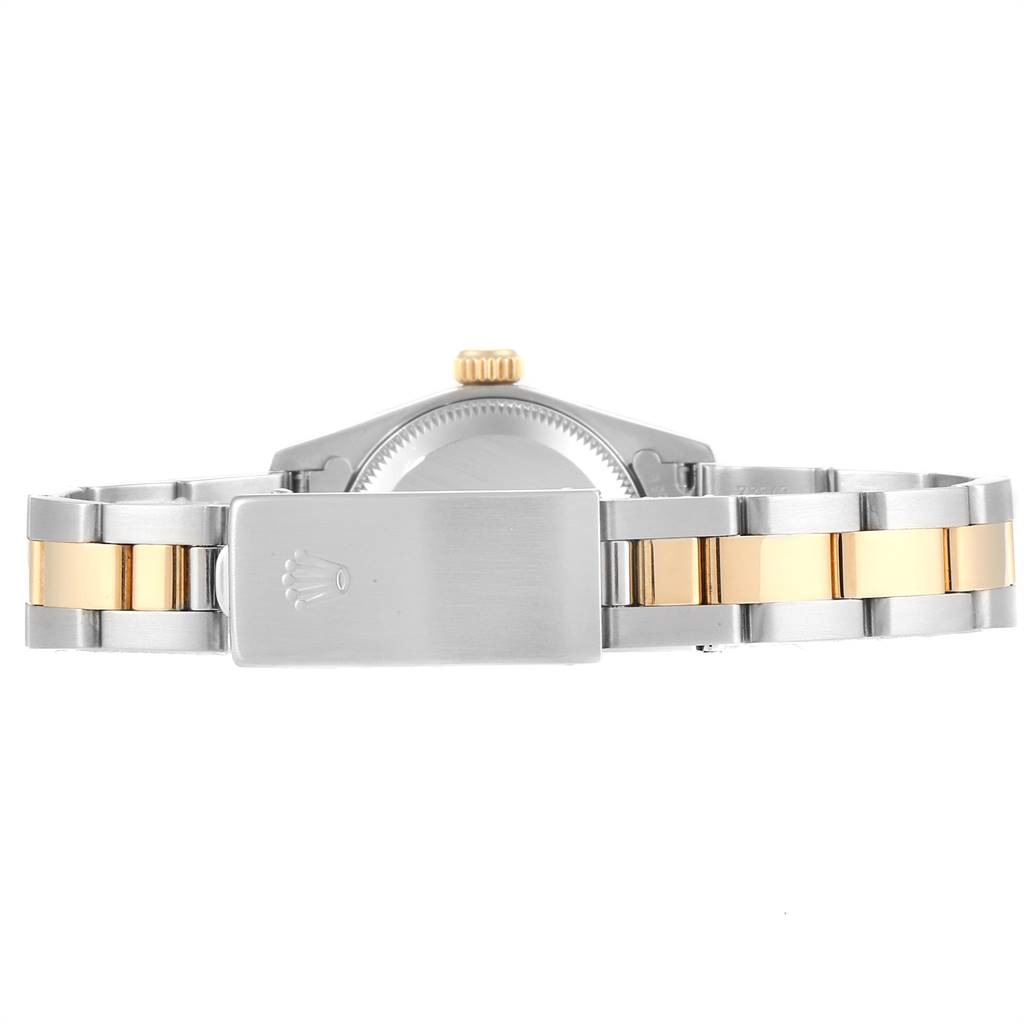 The image shows the back view of a Rolex Oyster Perpetual 67183 Women
s Steel and Gold (two tone) Champagne Dial 67183 Women
s Steel and Gold (two tone) Champagne Dial watch, displaying the bracelet and clasp.