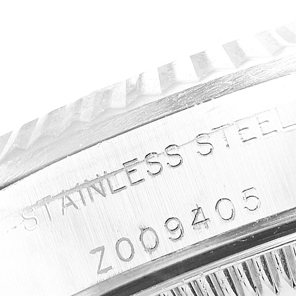 This image shows a close-up angle of the stainless steel case back engraving on a Rolex Oyster Perpetual 76094 Women's Stainless Steel Silver Dial 76094 Women's Stainless Steel Silver Dial watch.