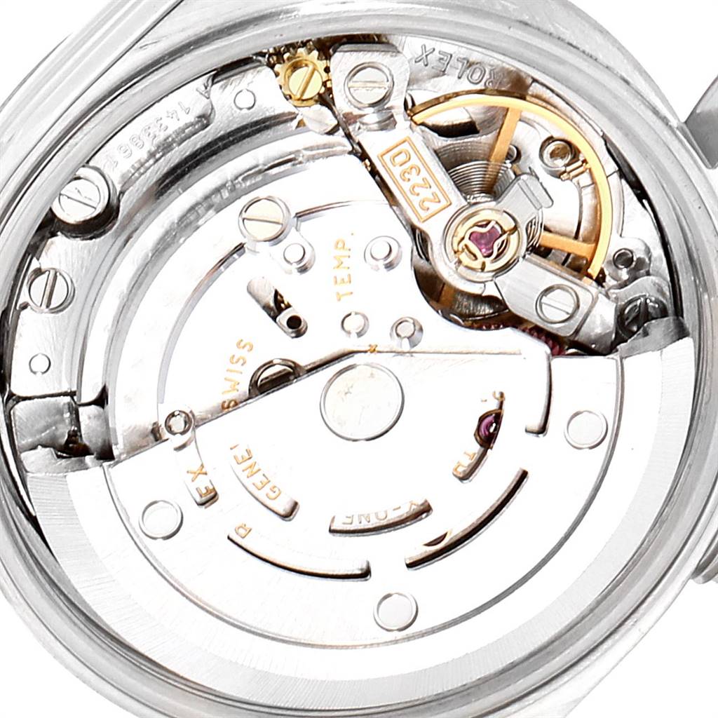 This image shows a close-up angle of the Rolex Oyster Perpetual 76094 Women's Stainless Steel Silver Dial 76094 Women's Stainless Steel Silver Dial watch movement, highlighting its intricate inner mechanics.