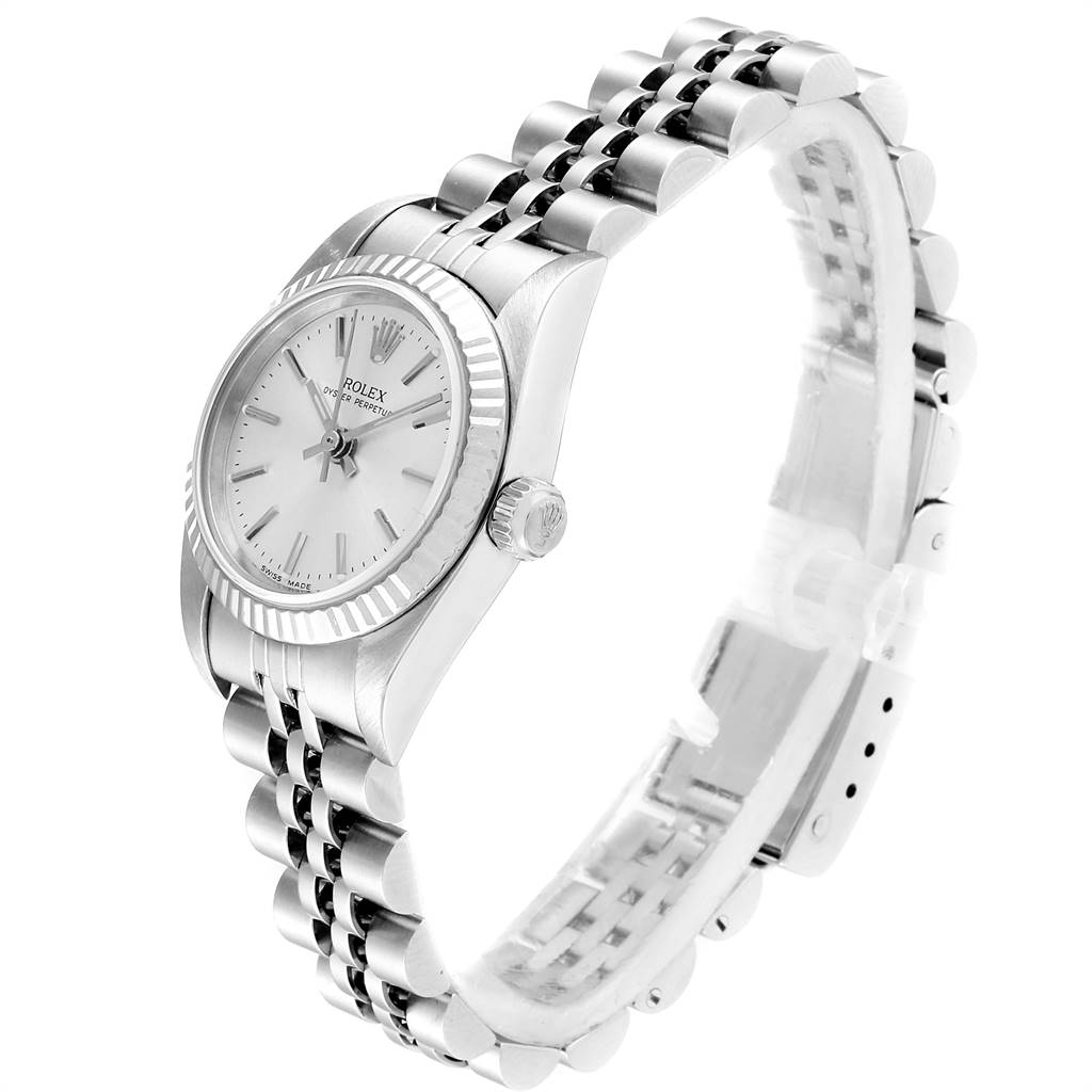 The Rolex Oyster Perpetual 76094 Women's Stainless Steel Silver Dial 76094 Women's Stainless Steel Silver Dial watch is shown at an angled side view, displaying the watch face, bezel, crown, and bracelet.