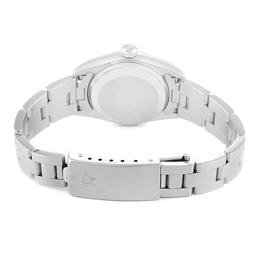 The image shows the back view of a Rolex Oyster Perpetual 76080 Women
s Stainless Steel White Dial 76080 Women
s Stainless Steel White Dial watch, highlighting its case back and metal bracelet clasp.