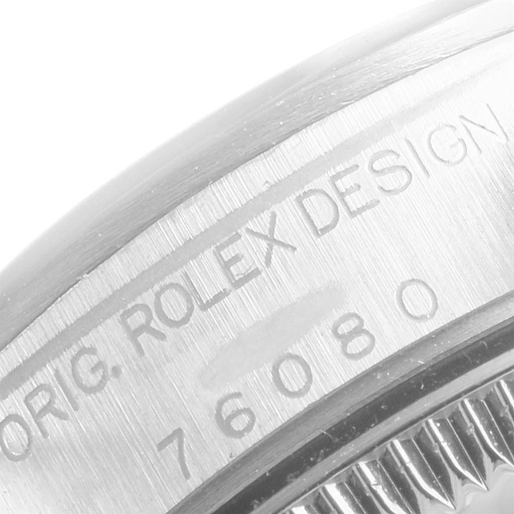 The image shows a close-up of the case back with engravings of the Rolex Oyster Perpetual 76080 Women's Stainless Steel Blue Dial 76080 Women's Stainless Steel Blue Dial watch.