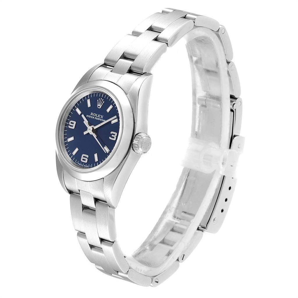 The Oyster Perpetual Rolex watch is shown at a side angle displaying the face, crown, and part of the bracelet.