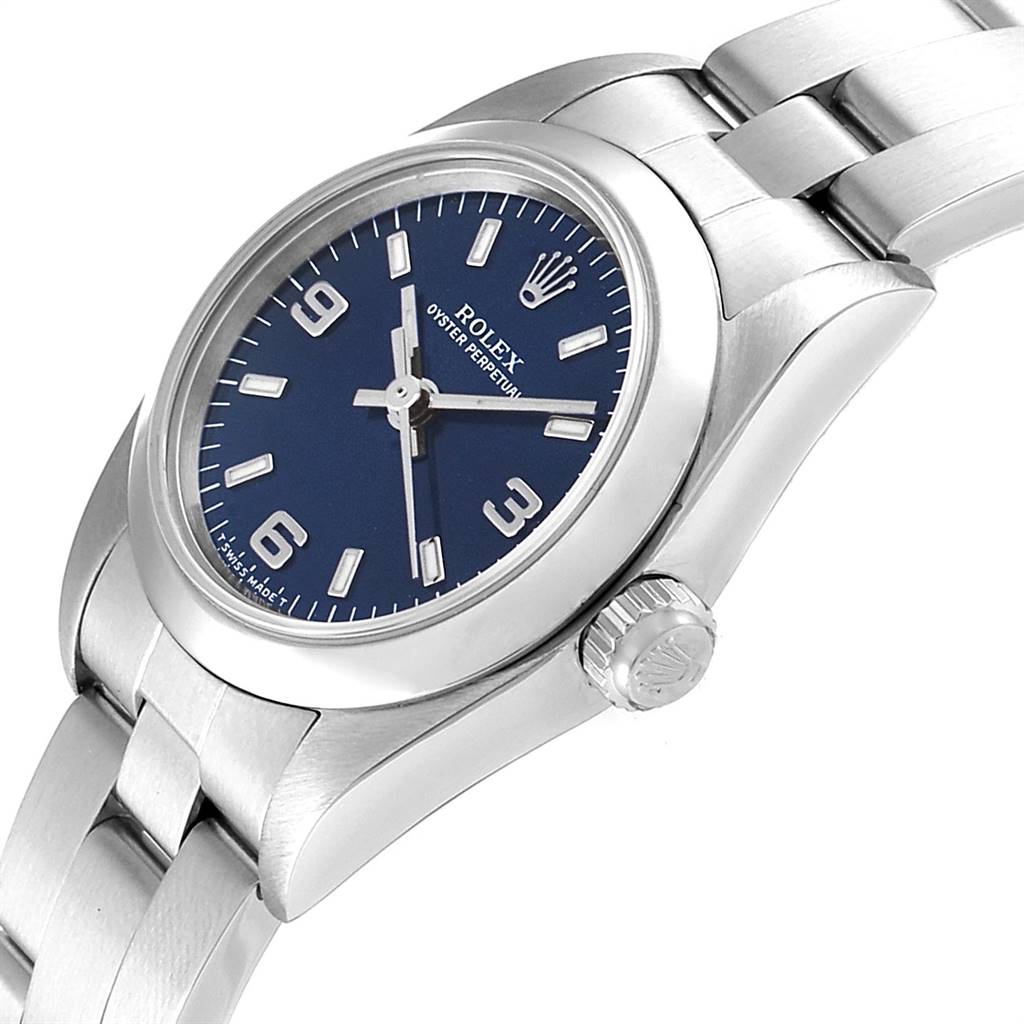 The image shows a side-angle view of the Rolex Oyster Perpetual 76080 Women's Stainless Steel Blue Dial 76080 Women's Stainless Steel Blue Dial watch, highlighting the crown, blue dial, and part of the bracelet.