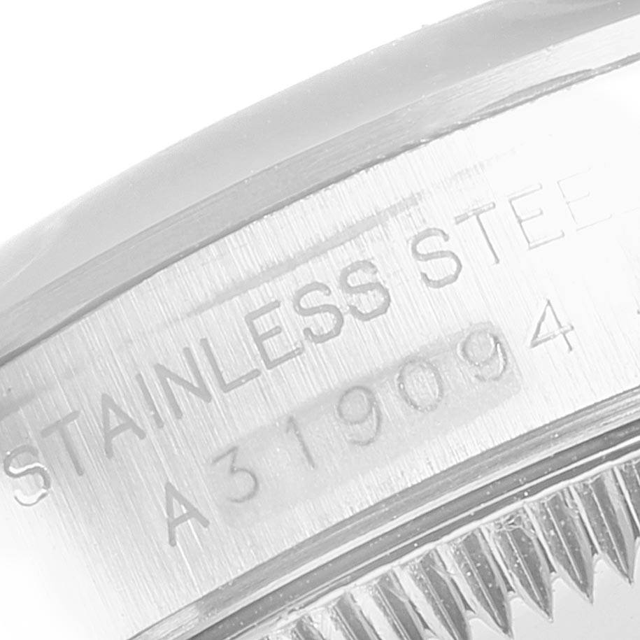 This close-up image shows the side of the case and the serial number engraving on the Rolex Oyster Perpetual 76080 Women's Stainless Steel Blue Dial 76080 Women's Stainless Steel Blue Dial watch.