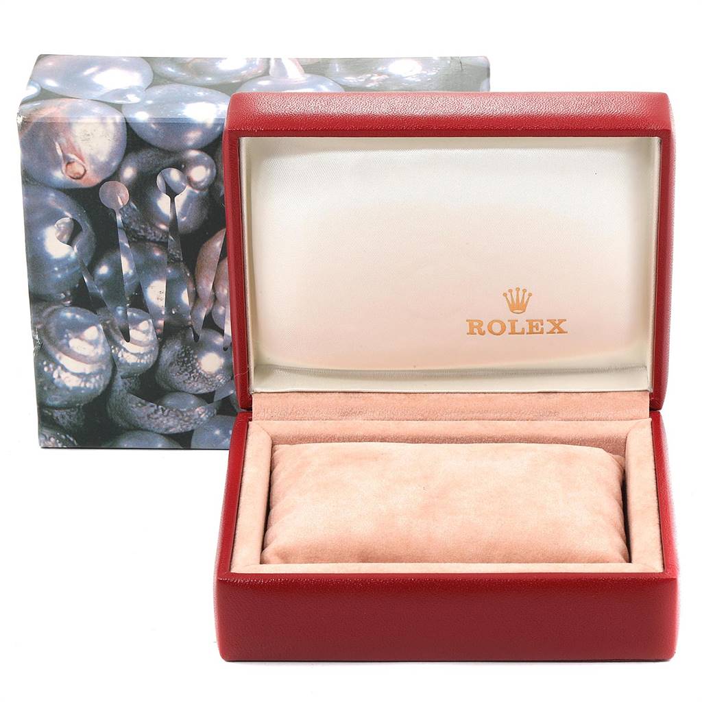 This image shows an open red Rolex watch box, designed for the Oyster Perpetual model, with the Rolex logo inside the lid.