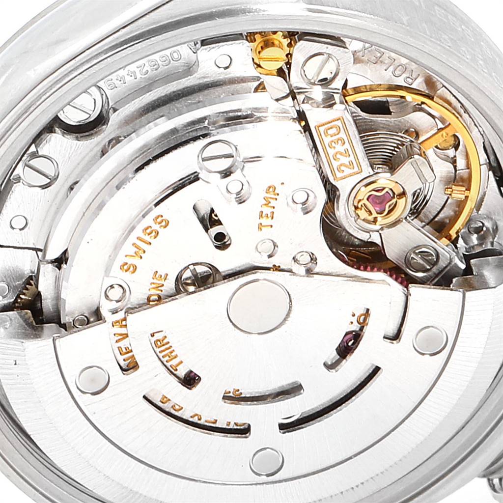 This image shows a close-up view of the internal movement mechanism of a Rolex Oyster Perpetual 76080 Women's Stainless Steel Blue Dial 76080 Women's Stainless Steel Blue Dial watch.