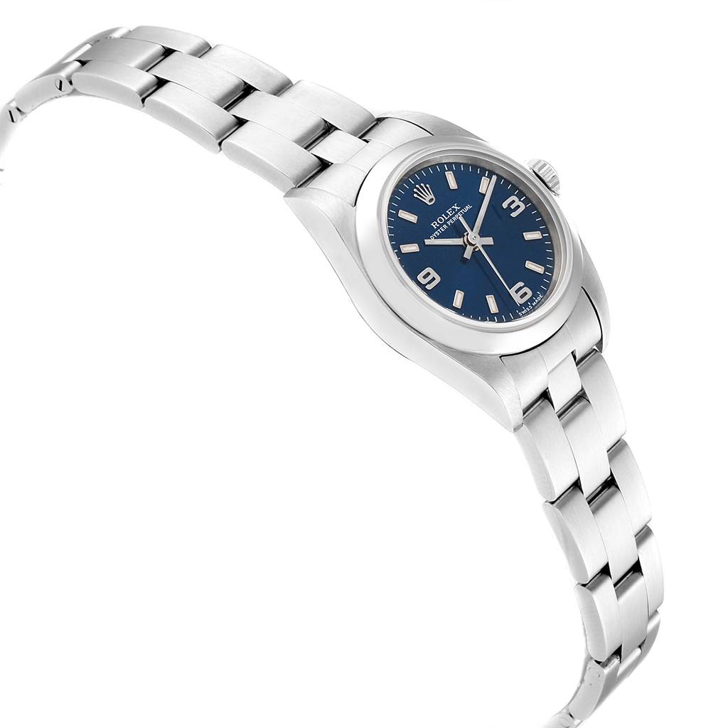 The image shows a side angle of the Rolex Oyster Perpetual 76080 Women's Stainless Steel Blue Dial 76080 Women's Stainless Steel Blue Dial watch, highlighting the bracelet, case, and blue dial.