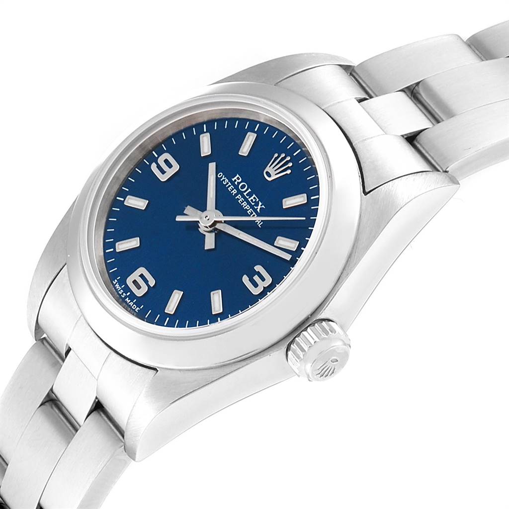 The image shows a Rolex Oyster Perpetual 76080 Women's Stainless Steel Blue Dial 76080 Women's Stainless Steel Blue Dial watch at an angled close-up, highlighting the dial, case, and part of the bracelet.