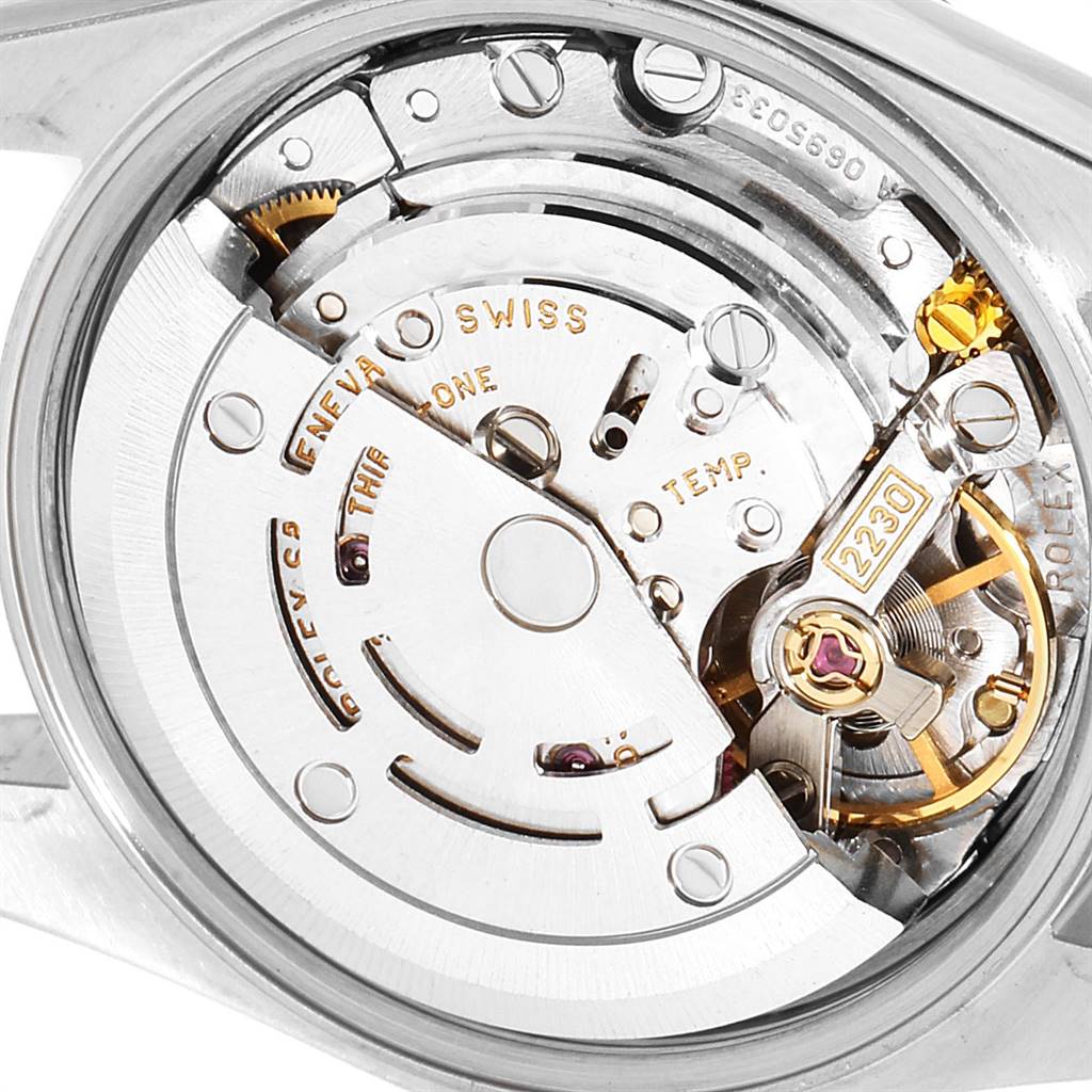 This image shows the internal movement mechanism of a Rolex Oyster Perpetual 76193 Women
s Steel and Gold (two tone) Champagne Dial 76193 Women
s Steel and Gold (two tone) Champagne Dial watch, specifically the caliber 2230.