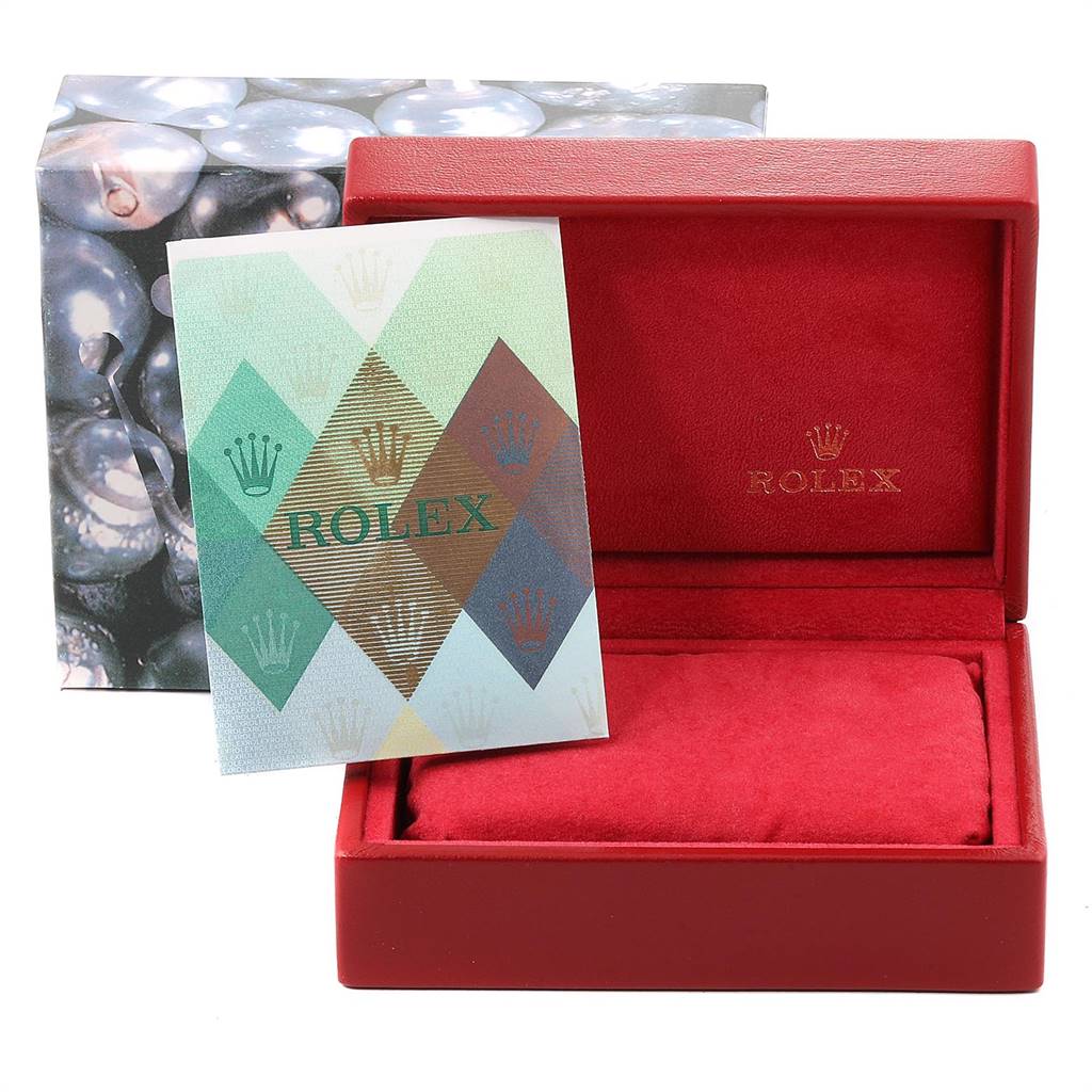 The image shows the packaging and a warranty card for a Rolex Oyster Perpetual 76193 Women
s Steel and Gold (two tone) Champagne Dial 76193 Women
s Steel and Gold (two tone) Champagne Dial watch.