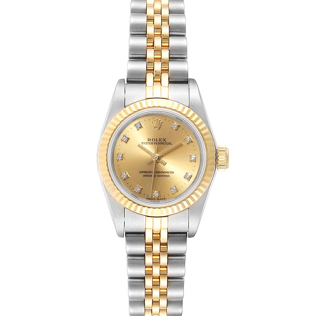 The image shows a front view of a Rolex Oyster Perpetual 76193 Women
s Steel and Gold (two tone) Champagne Dial 76193 Women
s Steel and Gold (two tone) Champagne Dial watch, highlighting its dial, bezel, and bracelet.