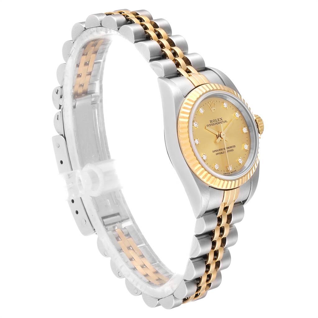 This image shows a side view of a Rolex Oyster Perpetual 76193 Women
s Steel and Gold (two tone) Champagne Dial 76193 Women
s Steel and Gold (two tone) Champagne Dial watch featuring a gold dial and a two-tone bracelet.