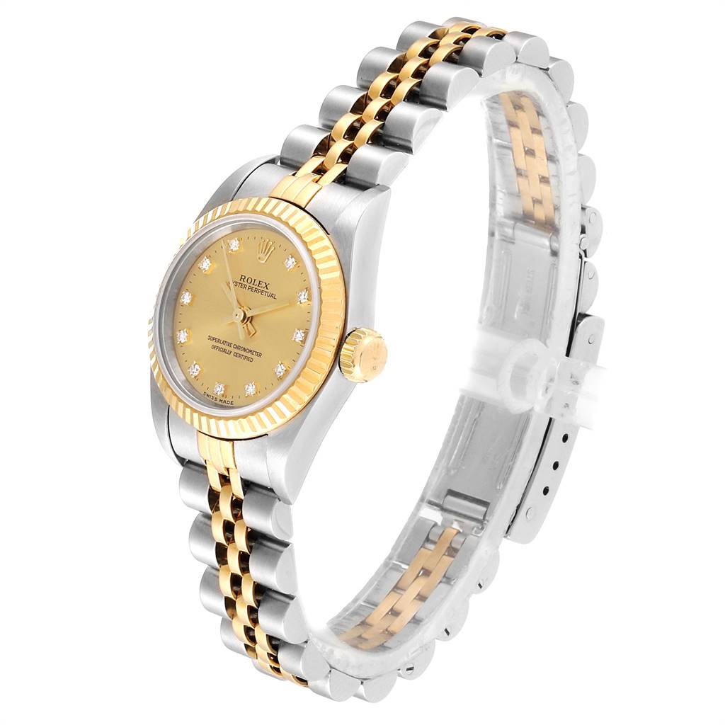 This image shows a Rolex Oyster Perpetual 76193 Women
s Steel and Gold (two tone) Champagne Dial 76193 Women
s Steel and Gold (two tone) Champagne Dial watch at a slight angle, displaying its dial, case, crown, and two-tone bracelet.