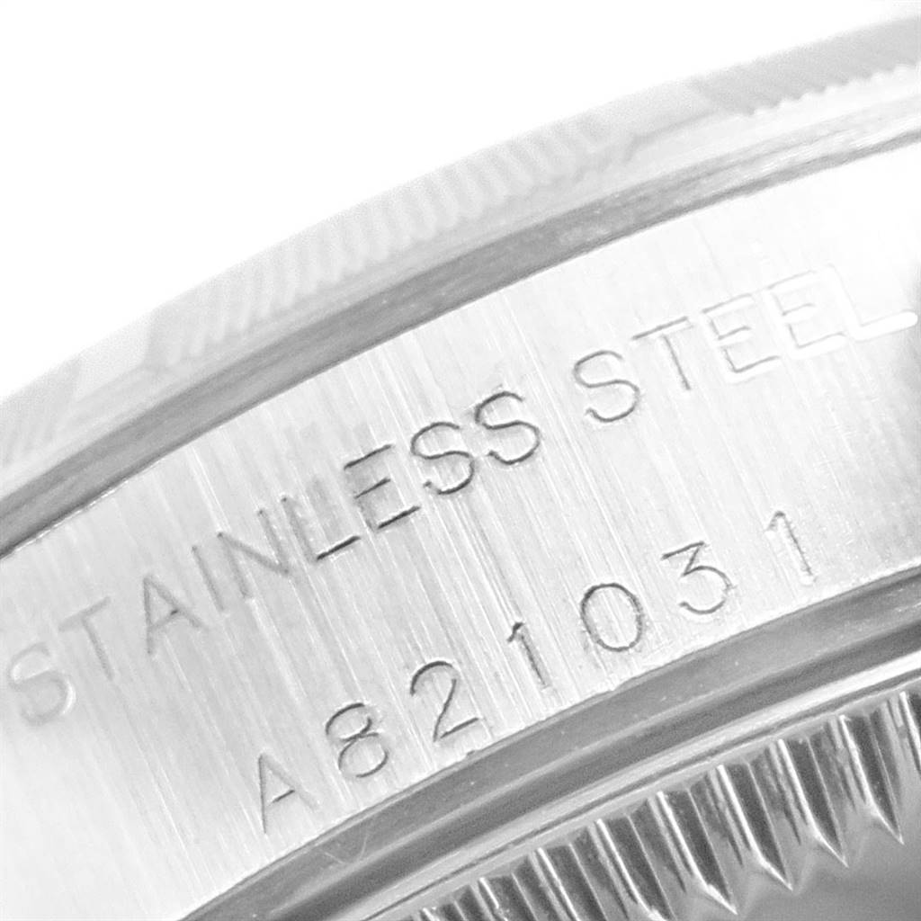 This image shows a close-up of the stainless steel case back of a Rolex Oyster Perpetual 76030 Women's Stainless Steel Pink Dial 76030 Women's Stainless Steel Pink Dial watch.