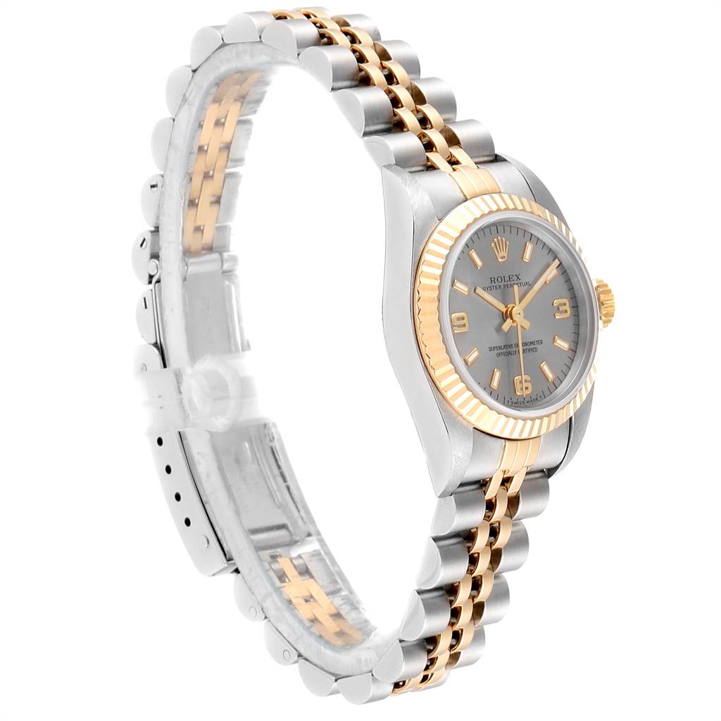 The image shows a Rolex Oyster Perpetual 67193 Women's Steel and Gold (two tone) Grey Dial 67193 Women's Steel and Gold (two tone) Grey Dial watch at an oblique side angle, highlighting its bracelet, bezel, and face.