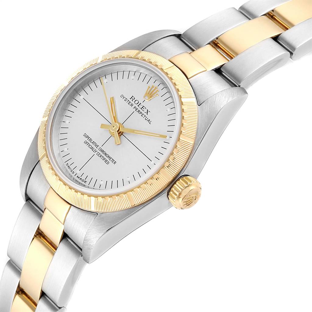 This image shows a close-up angled view of the Rolex Oyster Perpetual 76243 Women's Steel and Gold (two tone) Silver Dial 76243 Women's Steel and Gold (two tone) Silver Dial watch, highlighting the dial, bezel, and bracelet.
