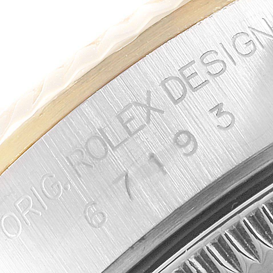 The image shows a close-up angle of the engraved text on the side of the Rolex Oyster Perpetual 67193 Women's Stainless Steel Champagne Dial 67193 Women's Stainless Steel Champagne Dial watch case.